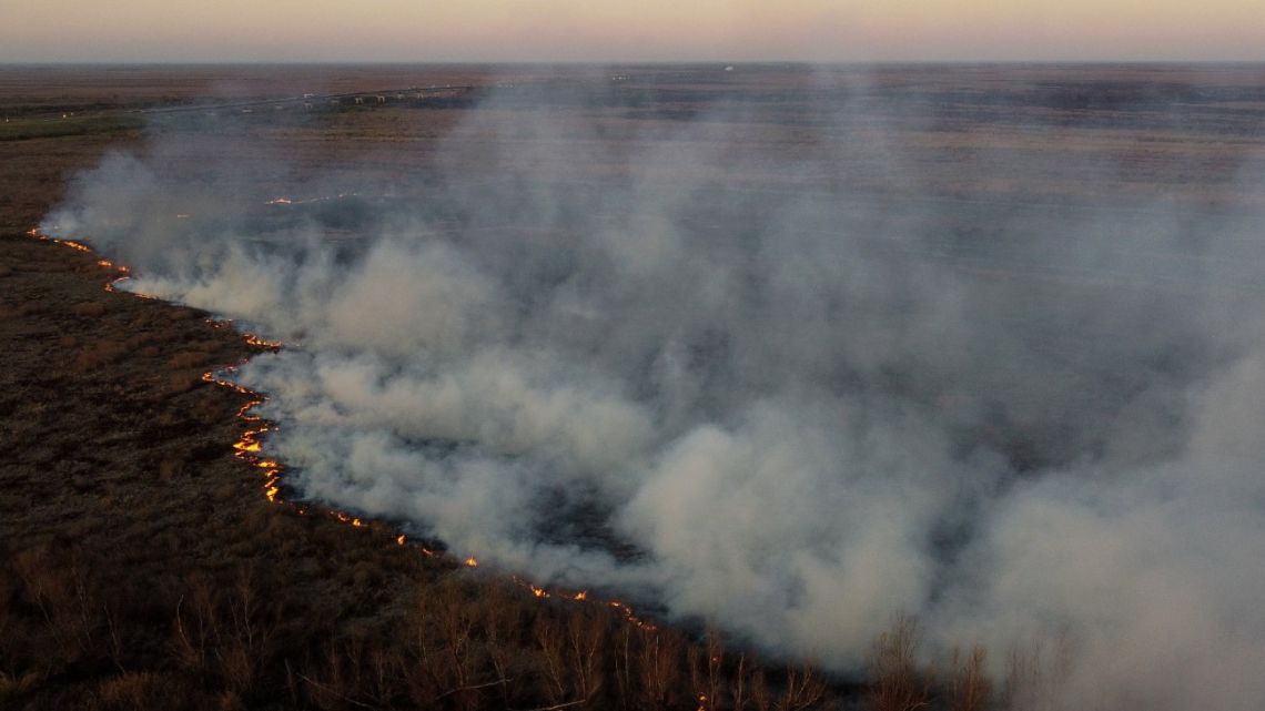 Aerial view showing wildfires raging through wetlands in islands in the Parana Deltá near Victoria, Entre Ríos Province, in front of the city of Rosario, in Santa Fe Province, on August 16, 2022. 