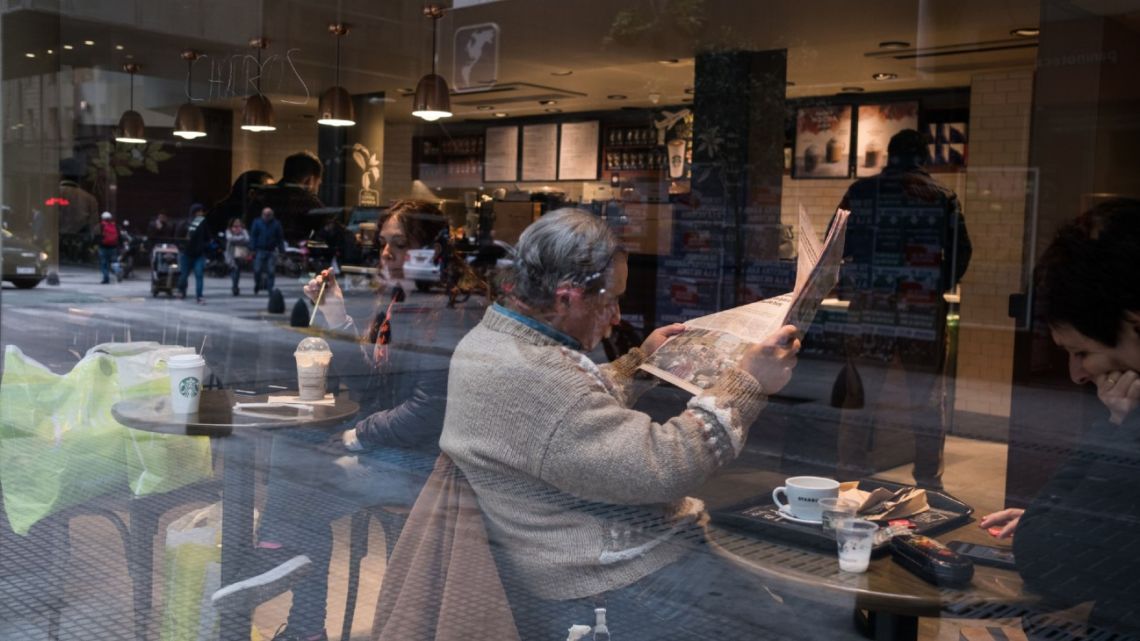 Customers enjoy a coffee at a branch of Starbucks in Buenos Aires.