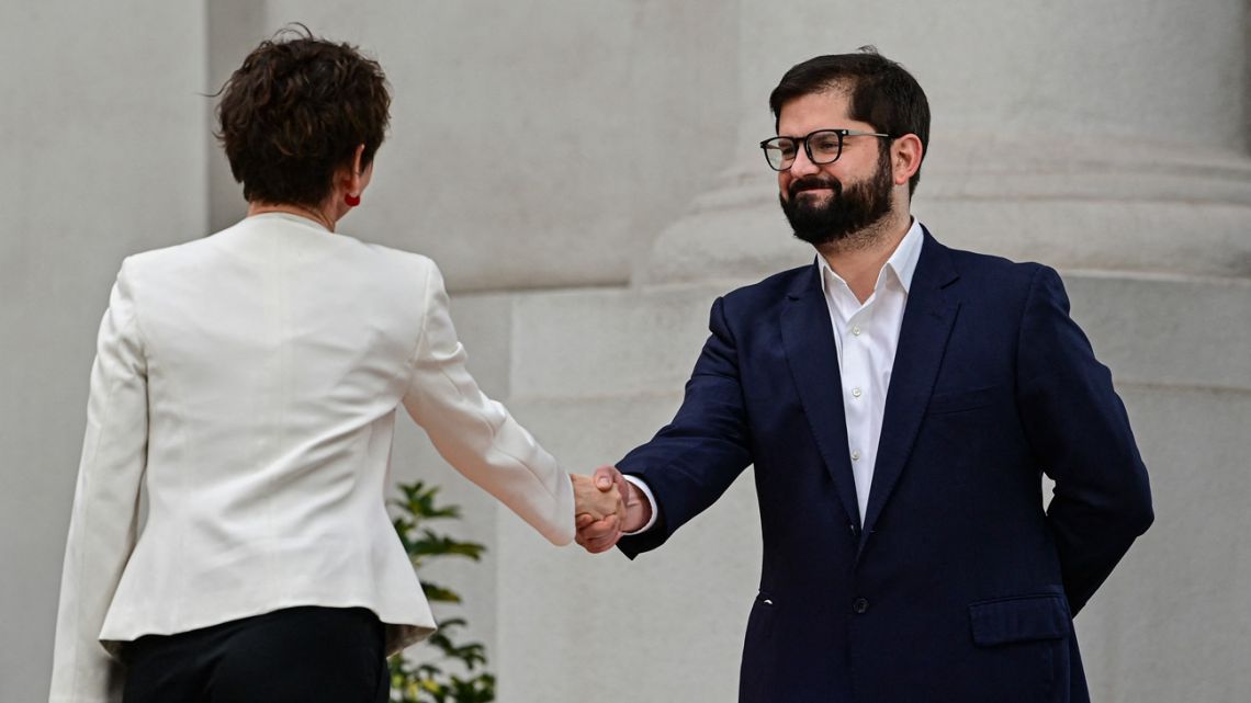 Chilean President Gabriel Boric greets the new Minister of the Interior and Public Security, Carolina Toha, during a ceremony at La Moneda presidential palace in Santiago, on September 6, 2022. 