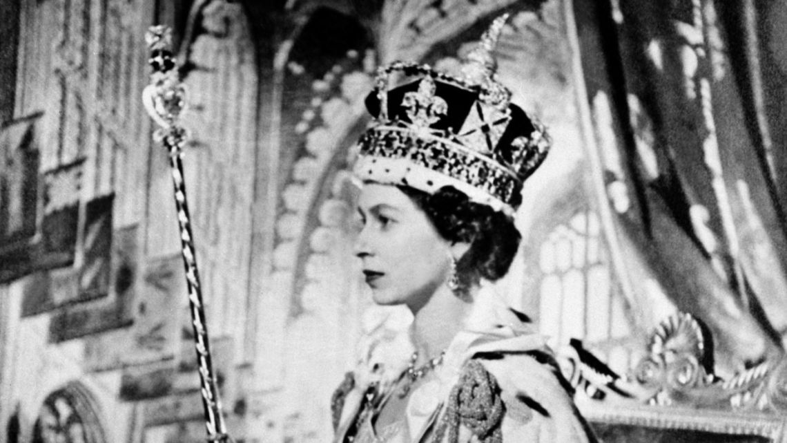  In this file photo taken on June 2, 1953, Queen Elizabeth II poses on her Coronation day, 02 June 1953 in London. 