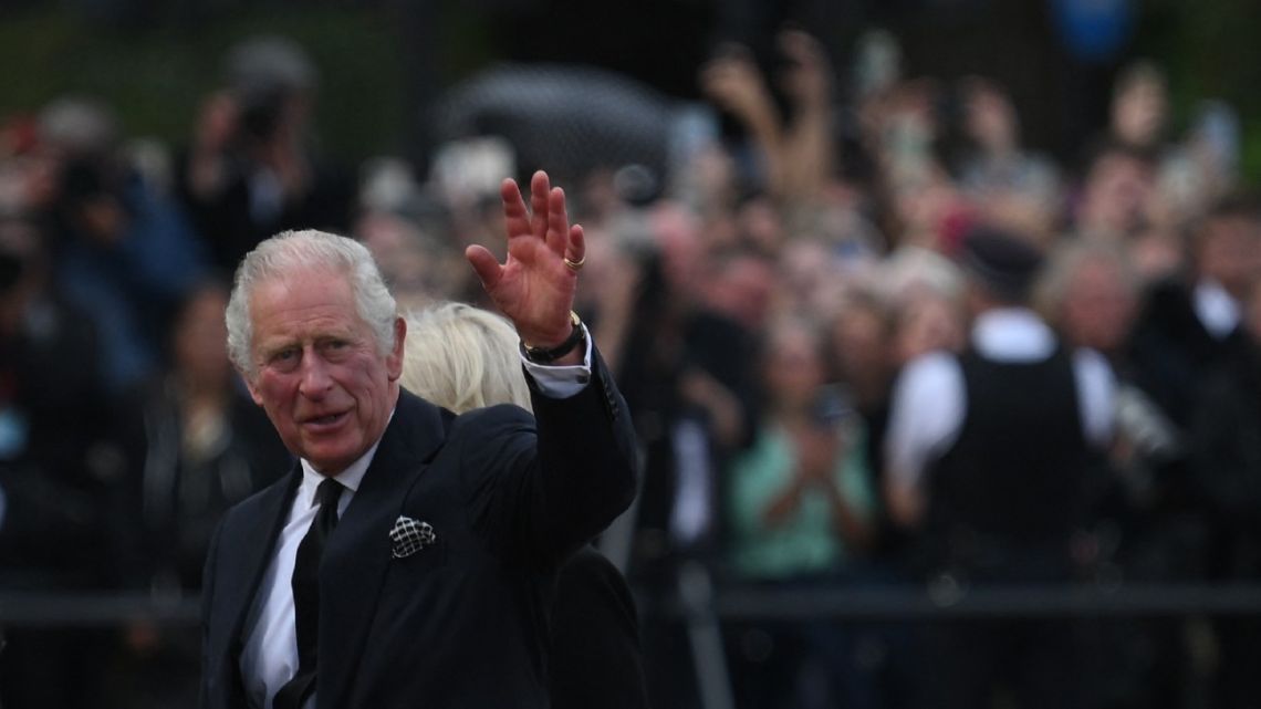 Britain's King Charles III greets the crowd upon his arrival Buckingham Palace in London, on September 9, 2022, a day after Queen Elizabeth II died at the age of 96.