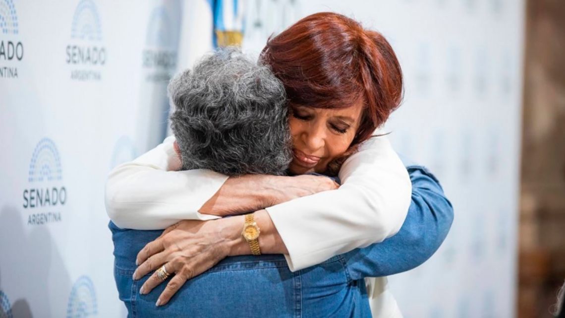 Cristina Fernández de Kirchner is embraced at a meeting at the Senate, two weeks after the failed assassination attempt.