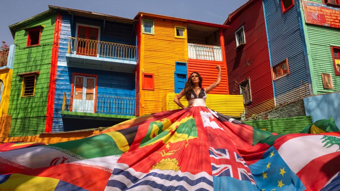 Handout photo released by the Buenos Aires City Government shows actress Florencia de la V wearing the Amsterdam Rainbow Dress at Caminito street in La Boca neighbourhood in Buenos Aires, in the framework of the Equal Rights Coalition (ERC) International Congress. Buenos Aires is the first Latin American city to receive the emblematic dress for the defence of LGBTIQ+ rights. 