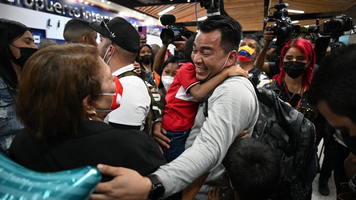 José Miguel Ramírez, a crew-member of the Venezuelan Boeing 747-300 from Emtrasur Cargo airline, is received by his relatives upon arrival at Simón Bolívar International Airport in Maiquetía, La Guaira State, Venezuela, on September 16, 2022. 