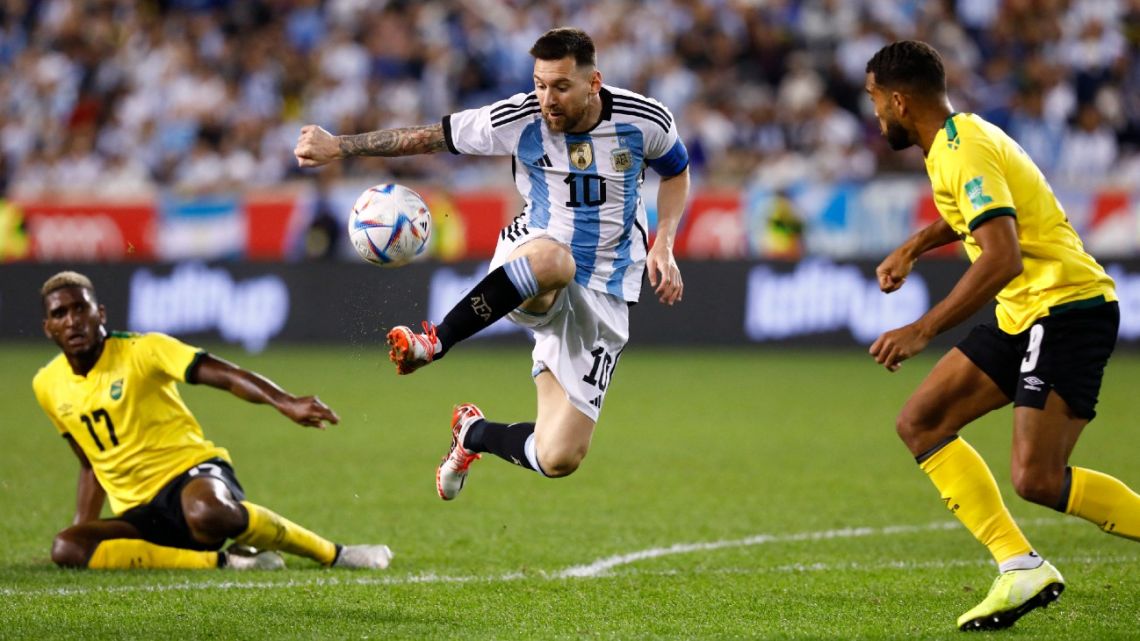 Argentina's Lionel Messi (left) vies for the ball with Jamaica's players during the international friendly football match between Argentina and Jamaica at Red Bull Arena in Harrison, New Jersey, on September 27, 2022. 