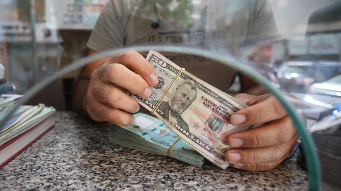 A money changer counts notes at his shop in the Lebanese capital Beirut on September 22, 2022.