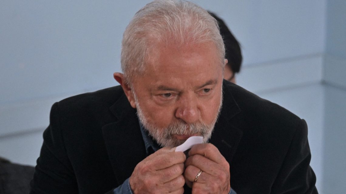 Brazilian former president (2003-2010) and candidate for the leftist Workers Party' (PT) Luiz Inácio Lula da Silva kisses the ballot as he votes during the legislative and presidential election, in São Paulo, Brazil, on October 2, 2022.
