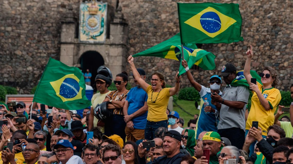 Supporters of Brazil President Jair Bolsonaro cheer on their candidate during campaigning.