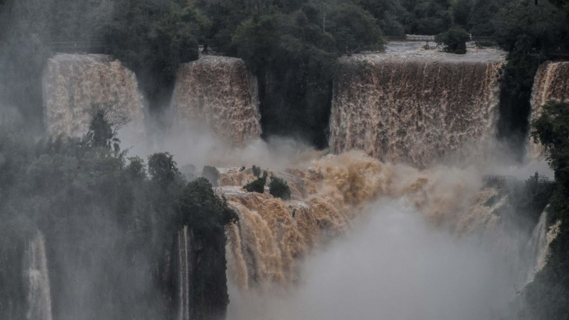 Picture of the Iguazú falls as seen from the Brazilian side on the border with Argentina, near Foz do Iguacu, Paraná state, Brazil on October 12, 2022. The quantity of water falling from the Iguazú falls has significantly increased in the last few days following heavy rains in the region.