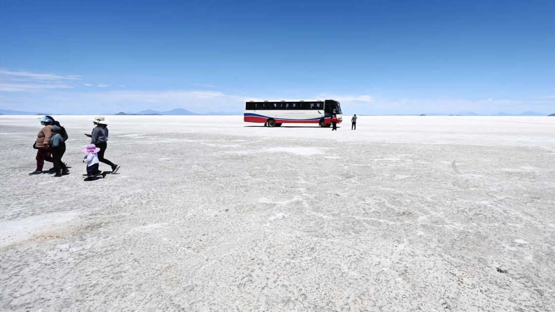 Tourists visit the Uyuni salt flat in Uyuni, Bolivia, on October 16, 2022. 