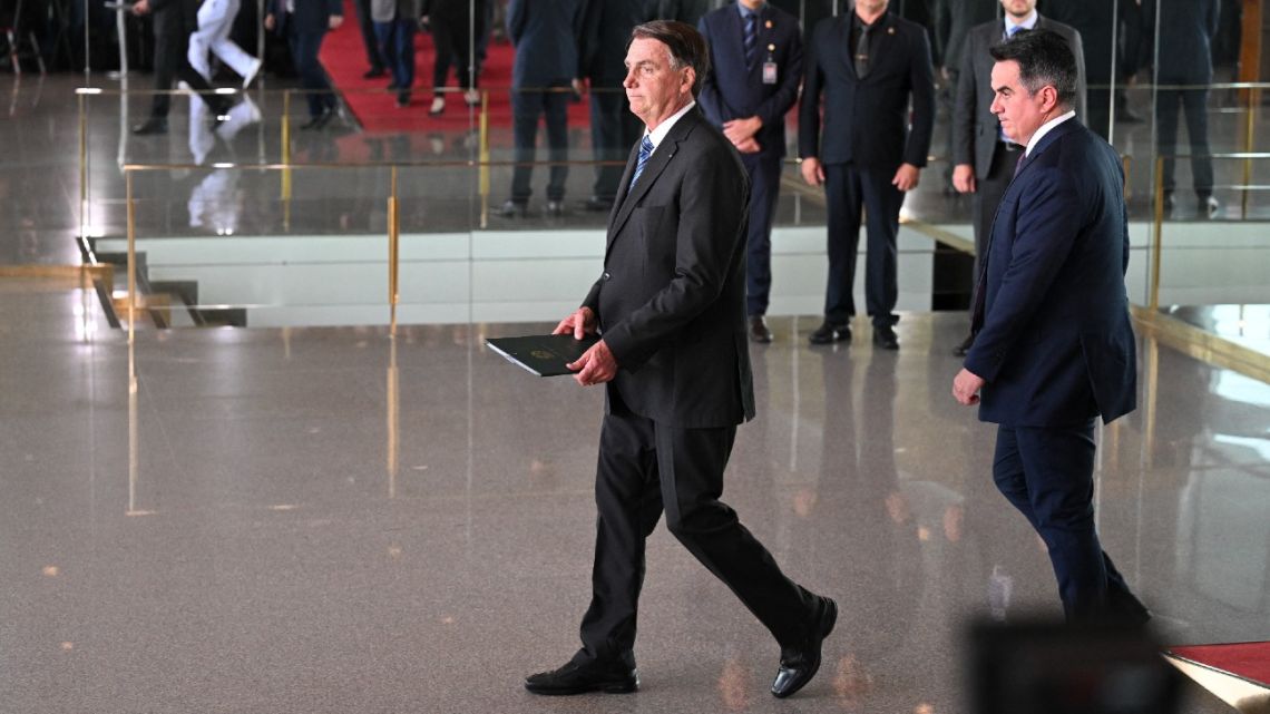 Brazilian President Jair Bolsonaro arrives to make a statement for the first time since Sunday's presidential run-off election, at Alvorada Palace in Brasilia, on November 1, 2022. 
