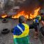 Brazil protesters block roads, airport as Bolsonaro stays silent