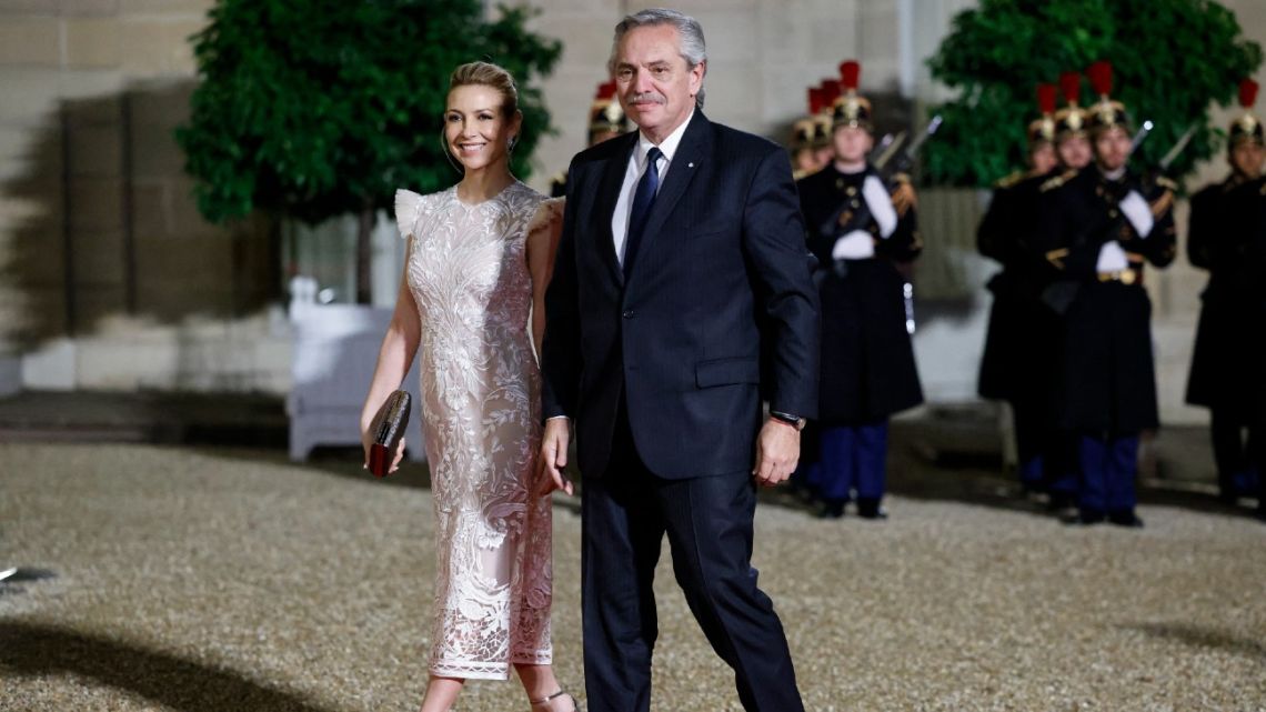 President Alberto Fernández (right) and First Lady Fabiola Yáñez arrive for the Paris Peace Forum closing diner at the Élysée Palace in Paris on November 11, 2022. 