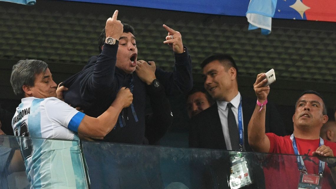Retired Argentina player Diego Maradona (C) gestures during the Russia 2018 World Cup Group D football match between Nigeria and Argentina at the Saint Petersburg Stadium in Saint Petersburg.