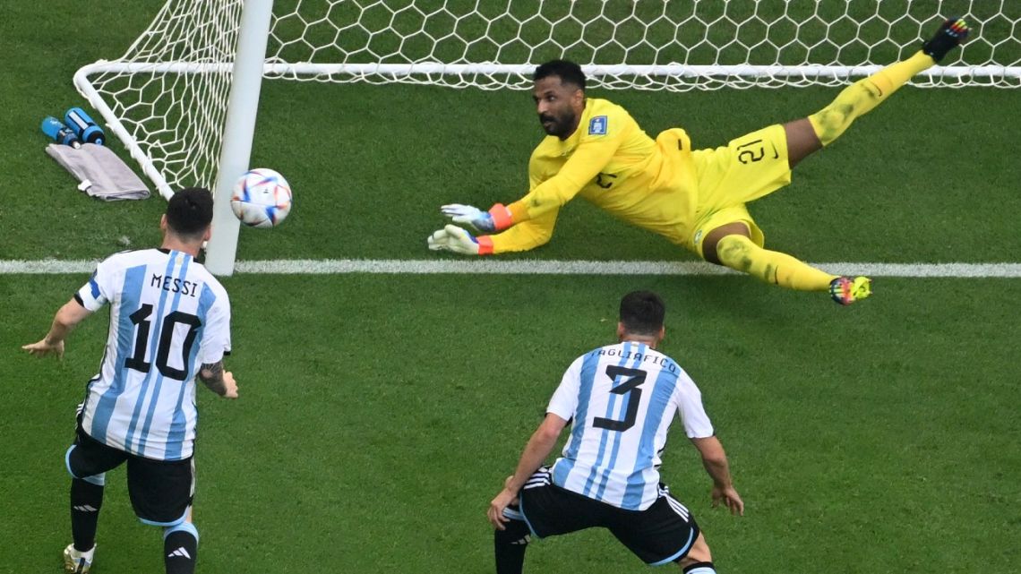 Saudi Arabia's goalkeeper #21 Mohammed Al-Owais (R) saves a shot during the Qatar 2022 World Cup Group C football match between Argentina and Saudi Arabia at the Lusail Stadium in Lusail, north of Doha on November 22, 2022. 