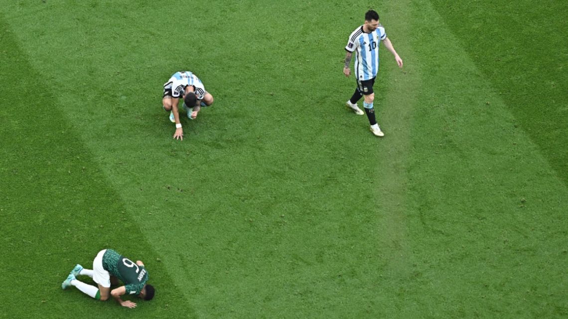 Saudi Arabia's forward #09 Firas Al-Buraikan celebrates as Argentina's forward #10 Lionel Messi leaves the pitch during the Qatar 2022 World Cup Group C football match between Argentina and Saudi Arabia at the Lusail Stadium in Lusail, north of Doha on November 22, 2022. 