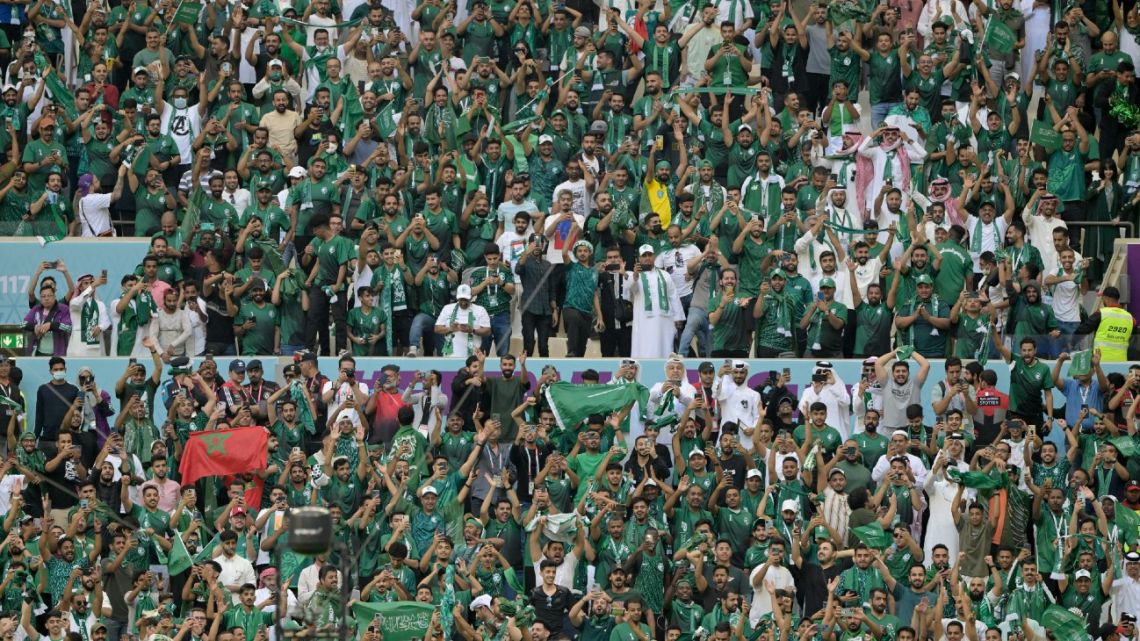 Saudi supporters cheers during the Qatar 2022 World Cup Group C football match between Argentina and Saudi Arabia at the Lusail Stadium in Lusail, north of Doha on November 22, 2022. 