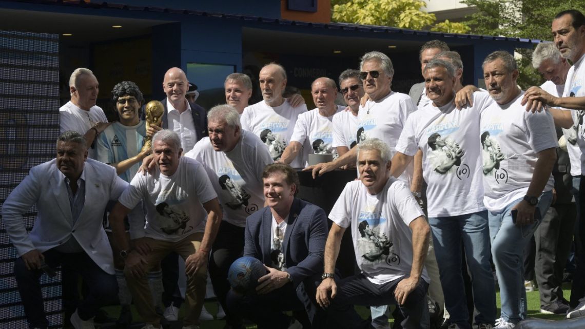 FIFA President Gianni Infantino, AFA President Claudio Tapía and CONMEBOL's President Alejandro Domínguez pose with Argentine ex-World Cup champions from the 1978 and 1986 tournaments and other footballing legends, such as Hristo Stoichkov, during a tribute ceremony to late football star Diego Maradona on the second anniversary of El Diez's death.