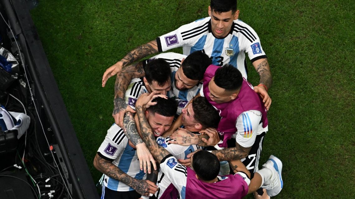 Argentina's midfielder #24 Enzo Fernández celebrates scoring his team's second goal with teammates during the Qatar 2022 World Cup Group C football match between Argentina and Mexico at the Lusail Stadium in Lusail, north of Doha on November 26, 2022. 