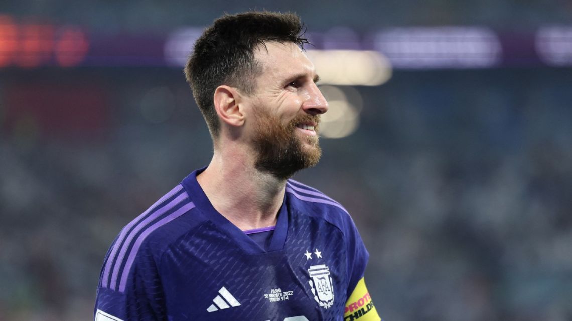 Albiceleste skipper #10 Lionel Messi smiles during the Qatar 2022 World Cup Group C football match between Poland and Argentina at Stadium 974 in Doha on November 30, 2022. 