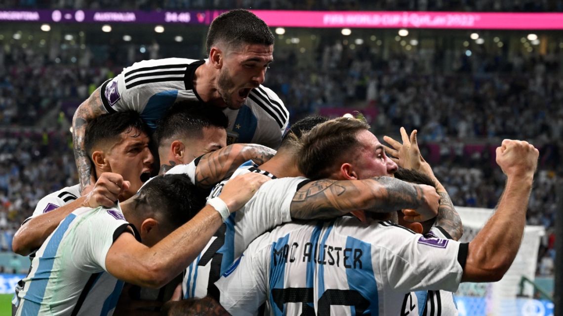 Argentina's forward #10 Lionel Messi (C) celebrates with teammates after he scored his team's first goal during the Qatar 2022 World Cup round of 16 football match between Argentina and Australia at the Ahmad Bin Ali Stadium in Al-Rayyan, west of Doha on December 3, 2022.