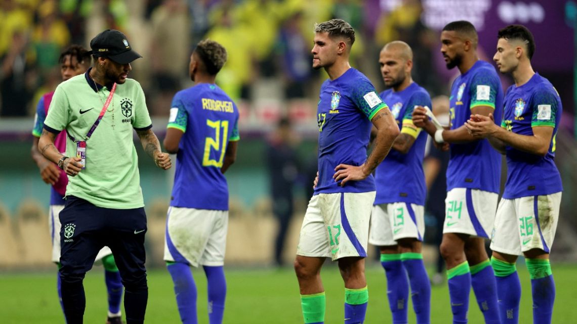 Brazil's Neymar and teammates react at the end of the Qatar 2022 World Cup Group G football match between Cameroon and Brazil at the Lusail Stadium in Lusail, north of Doha on December 2, 2022.
