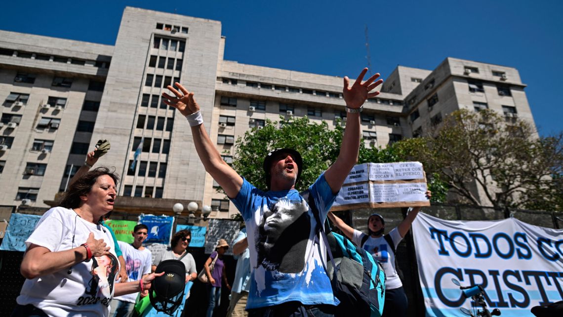 Supporters of Argentina's Vice-President Cristina Fernández de Kirchner shout slogans outside the Comodoro Py federal courthouse in Buenos Aires on December 6, 2022. 