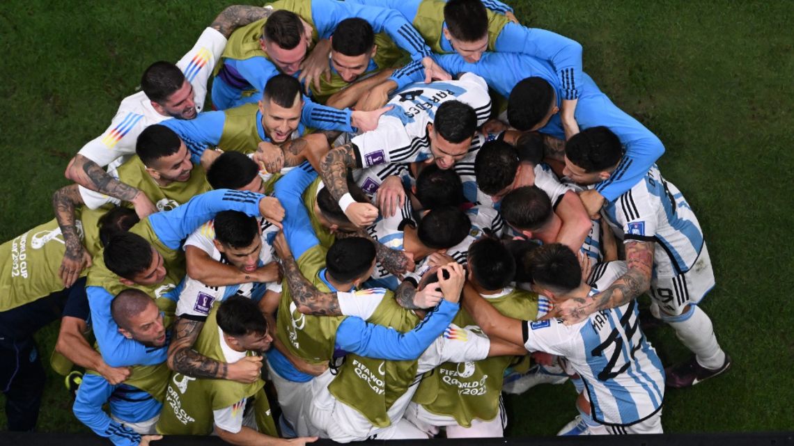 Argentina players celebrate after Lionel Messi scored his team's second goal from the penalty spot during the Qatar 2022 World Cup quarter-final football match between The Netherlands and Argentina at Lusail Stadium, north of Doha on December 9, 2022. 