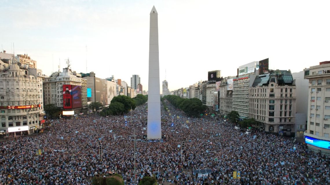 In this aerial view, fans of Argentina celebrate their team's victory after the Qatar 2022 World Cup semifinal football match between Croatia and Argentina at the Obelisk in Buenos Aires on December 13, 2022. 