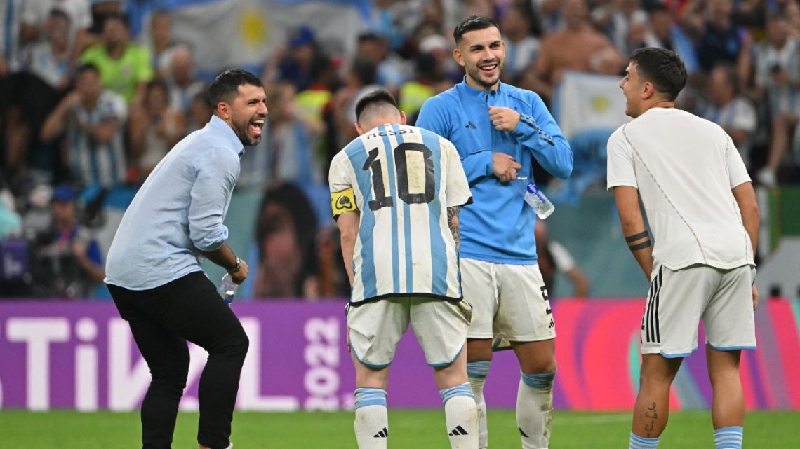 Lionel Messi, Leandro Paredes and Paulo Dybala celebrate with retired ex-Albiceleste striker and former teammate Sergio Aguero after defeating the Netherlands in a penalty shoot-out of the Qatar 2022 World Cup quarter-final football match at the Lusail Stadium, north of Doha, on December 9, 2022. 