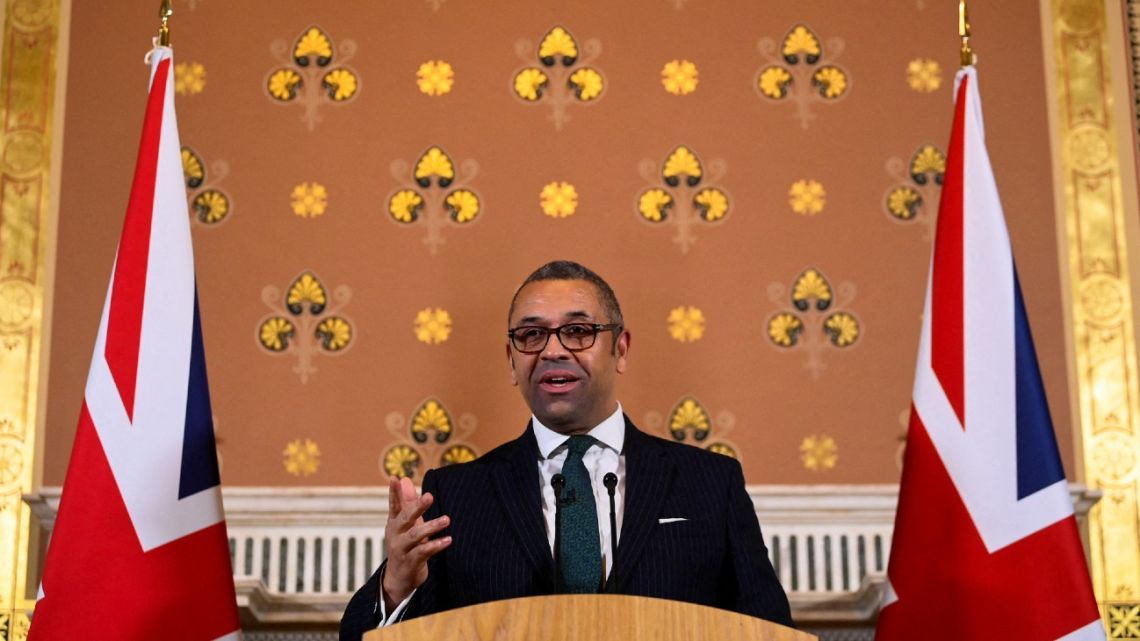 British Foreign Secretary James Cleverly speaks to members of the press in London on December 12, 2022. Post-Brexit Britain must look beyond its traditional allies to emerging powers in Latin America, Asia and Africa, Cleverly was set to say. 
