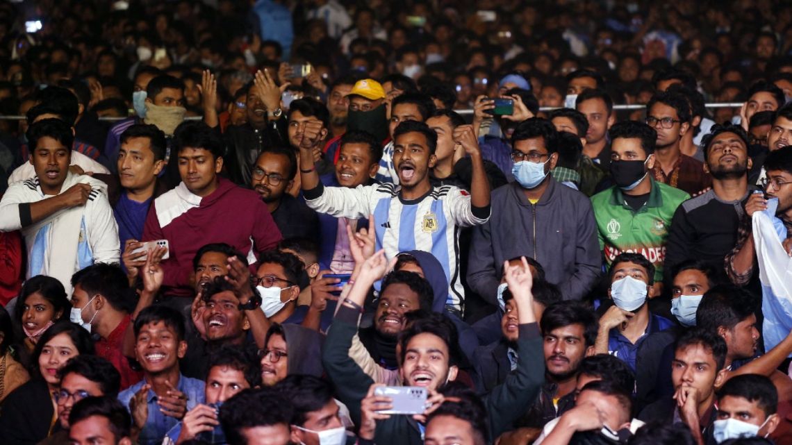Argentina supporters react as they watch the final football match of the Qatar 2022 World Cup between Argentina and France in Dhaka, Bangladesh on December 18, 2022. 