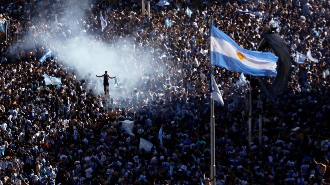 In this aerial view fans of Argentina gather at the Obelisk to celebrate winning the Qatar 2022 World Cup against France in Buenos Aires, on December 18, 2022. 