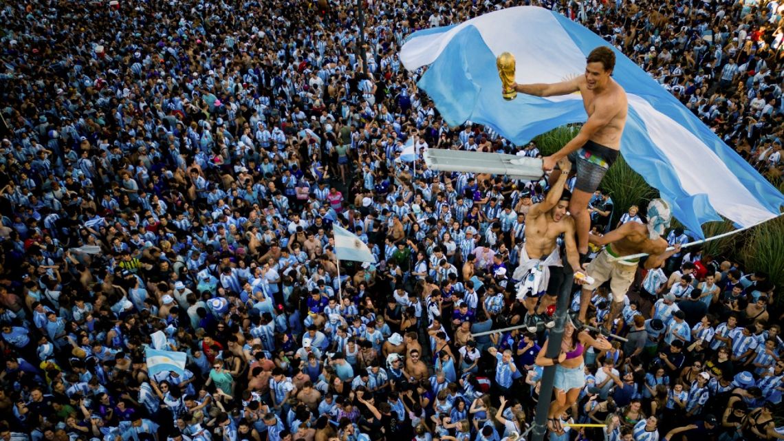 In this aerial view fans of Argentina celebrate winning the Qatar 2022 World Cup against France at the Obelisk in Buenos Aires, on December 18, 2022. 