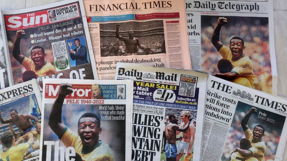 An arrangement of UK daily newspaper front pages photographed as an illustration in London on December 30, 2022, shows headlines reporting on the death of Brazilian football legend Pelé, who died on December 29, 2022. 