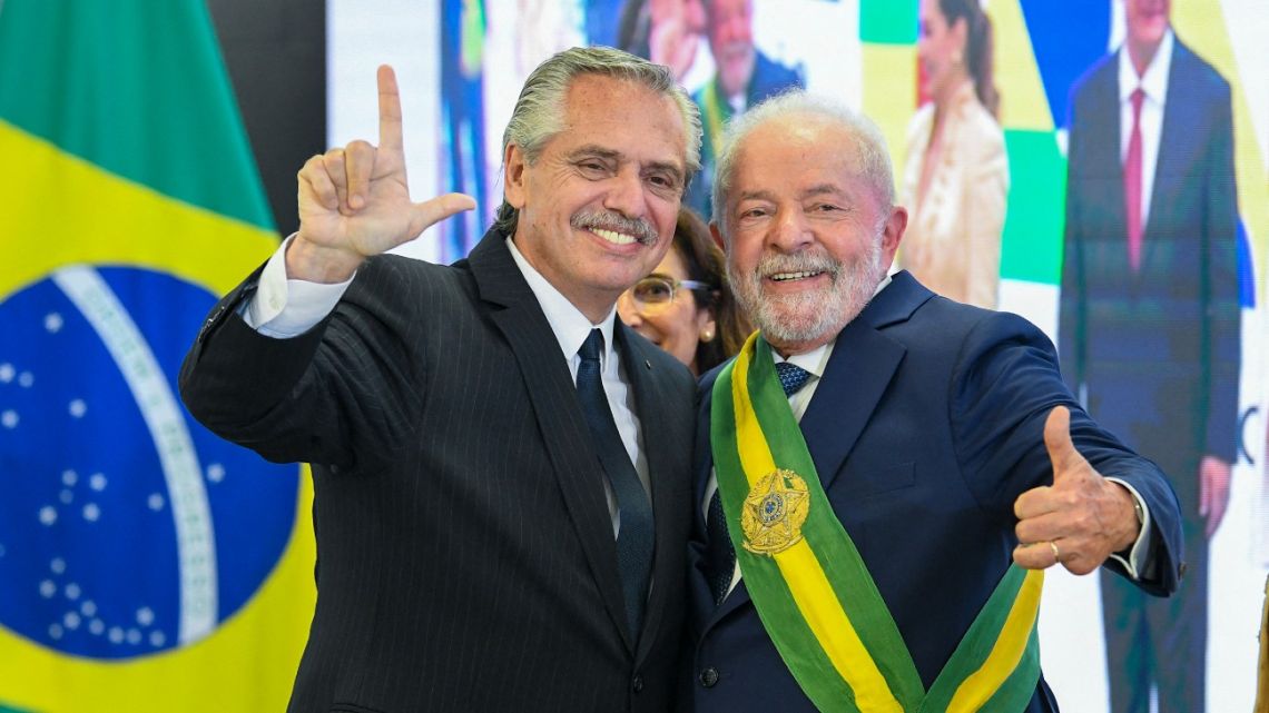 Brazil's new President Luiz Inácio Lula da Silva poses for a picture with Argentina's President Alberto Fernández at Planalto Palace after his inauguration ceremony at the National Congress, in Brasília, on January 1, 2023.