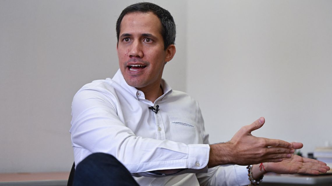 Venezuelan opposition leader Juan Guaidó gestures as he speaks during an interview with AFP at his office in Caracas on January 9, 2023. 