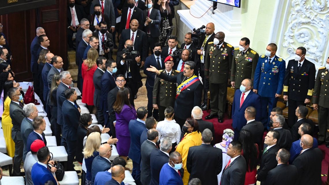 Venezuelan President Nicolas Maduro greets deputies of the National Assembly before his annual report in Caracas on January 12, 2023. 