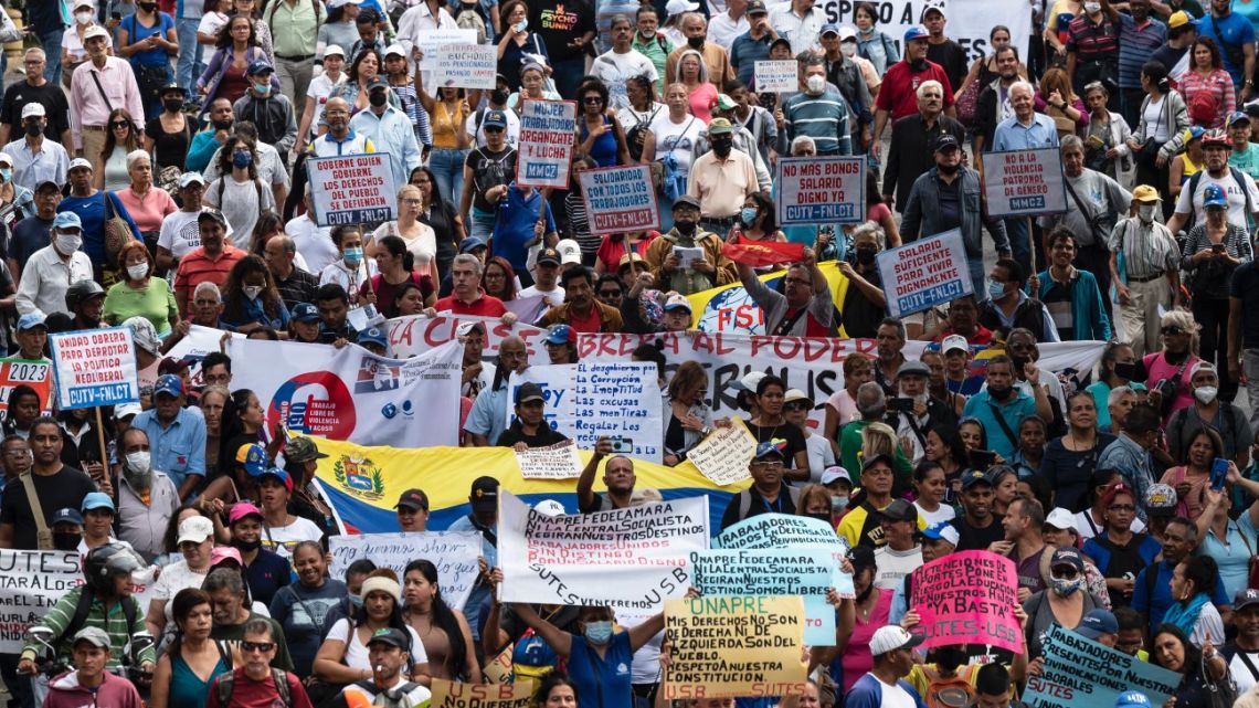 Protesters of the government of Venezuelan President Nicolás Maduro hold a demonstration demanding a leveling of salaries in line with the raising inflation and the high cost of the basic "family basket" in Caracas on January 23, 2023. 