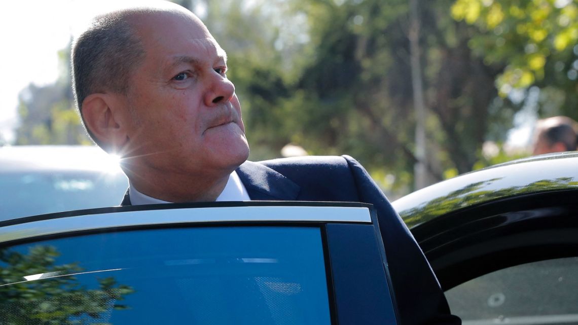 Germany's Chancellor Olaf Scholz leaves after a meeting with Chilean businessmen in Santiago, on January 30, 2023, before heading to Brazil.