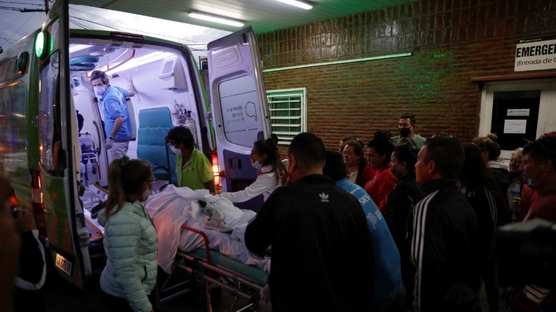 In this file photo taken on February 5, 2022, patients hospitalised after consuming cocaine cut with a toxic substance are transferred from the Hospital Dr. Carlos Bocalandro in Loma Hermosa to San Bernardino in Hurlingham, Buenos Aires Province, Argentina. 