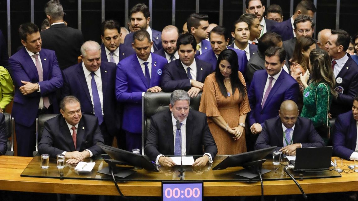 Brazilian deputy Arthur Lira (C) speaks after being re-elected as President of the Chamber of Deputies at the National Congress in Brasilia, on February 1, 2023. 