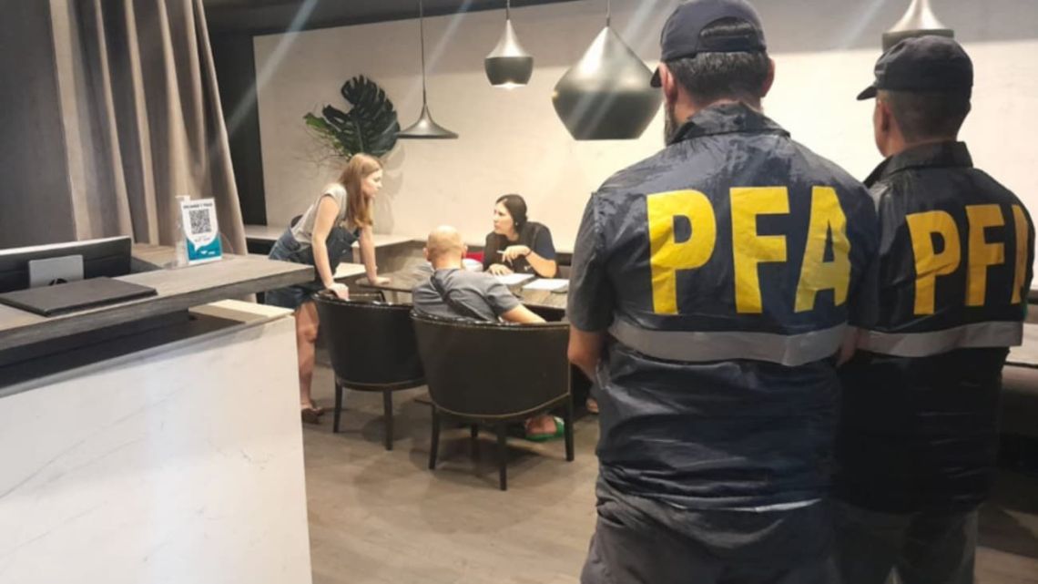 Federal police officers are pictured during a raid at a hotel in Puerto Madero.