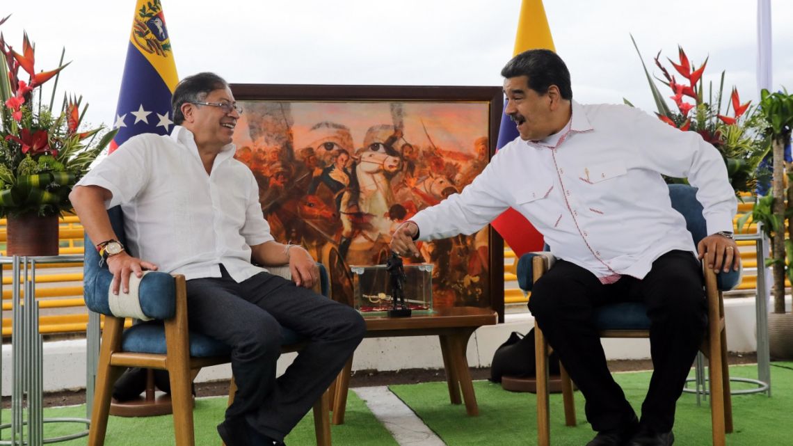 This picture released by Miraflores Palace press office shows Venezuelan President Nicolas Maduro (R) talking with his Colombian counterpart Gustavo Petro during a meeting at the Atanasio Girardot International Bridge in Ureña, Tachira state, Venezuela on February 16, 2023. 