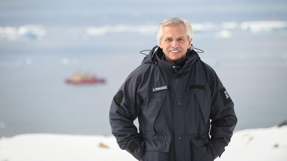 This handout picture released by the Presidency shows President Alberto Fernández posing for a picture ahead of the 'Almirante Irizar; ice breaker vessel at the Marambio base in the Antarctica on February 22, 2023.