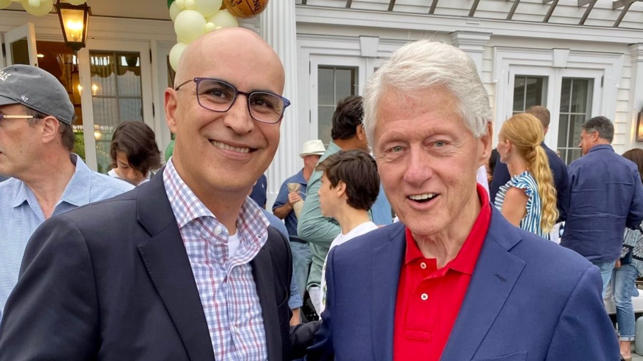 Marco Massotti, financista y dueño de SA Sharks, y Bill Clinton.