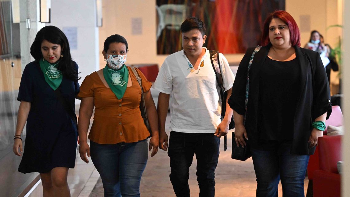 The mother (2-L) and brother (2-R) of Beatriz, a woman who died on 2013 after the Salvadoran state denied her of a necessary abortion, arrive to a conference to give details on the pending hearing of the trial against the Salvadoran state in San Salvador on March 6, 2023. 