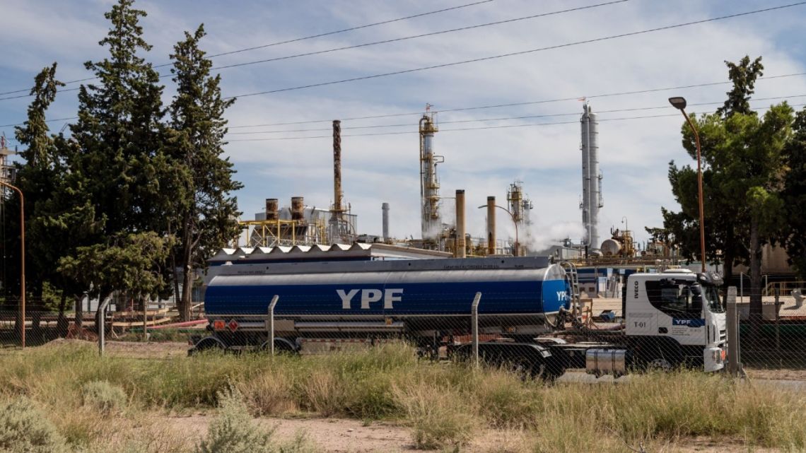 A truck passes a YPF SA facility in Plaza Huincul, Neuquén Province.