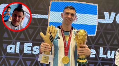 Dibu Martínez con el Guante de Oro y la Copa del Mundo