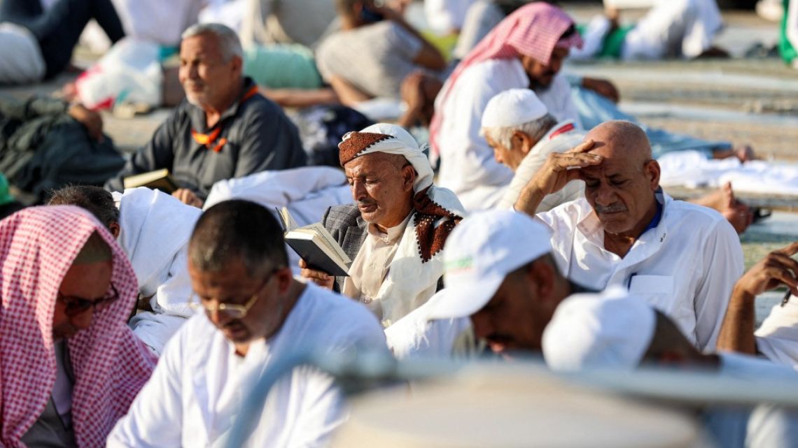 Muslim worshippers read from the Koran, Islam's holy book, while sitting at the Grand Mosque in the holy city of Mecca on March 23, 2023 on the first day of the holy fasting month of Ramadan.